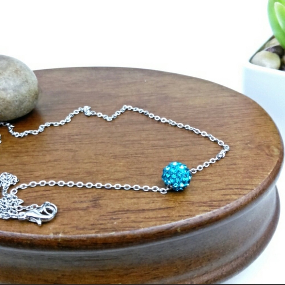 Blue rhinestone globe necklace